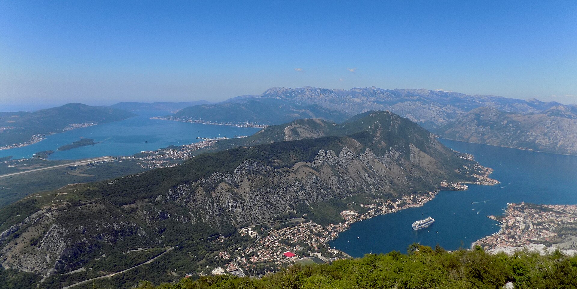A cruise ship sailing through the Bay of Kotor in Montenegro
