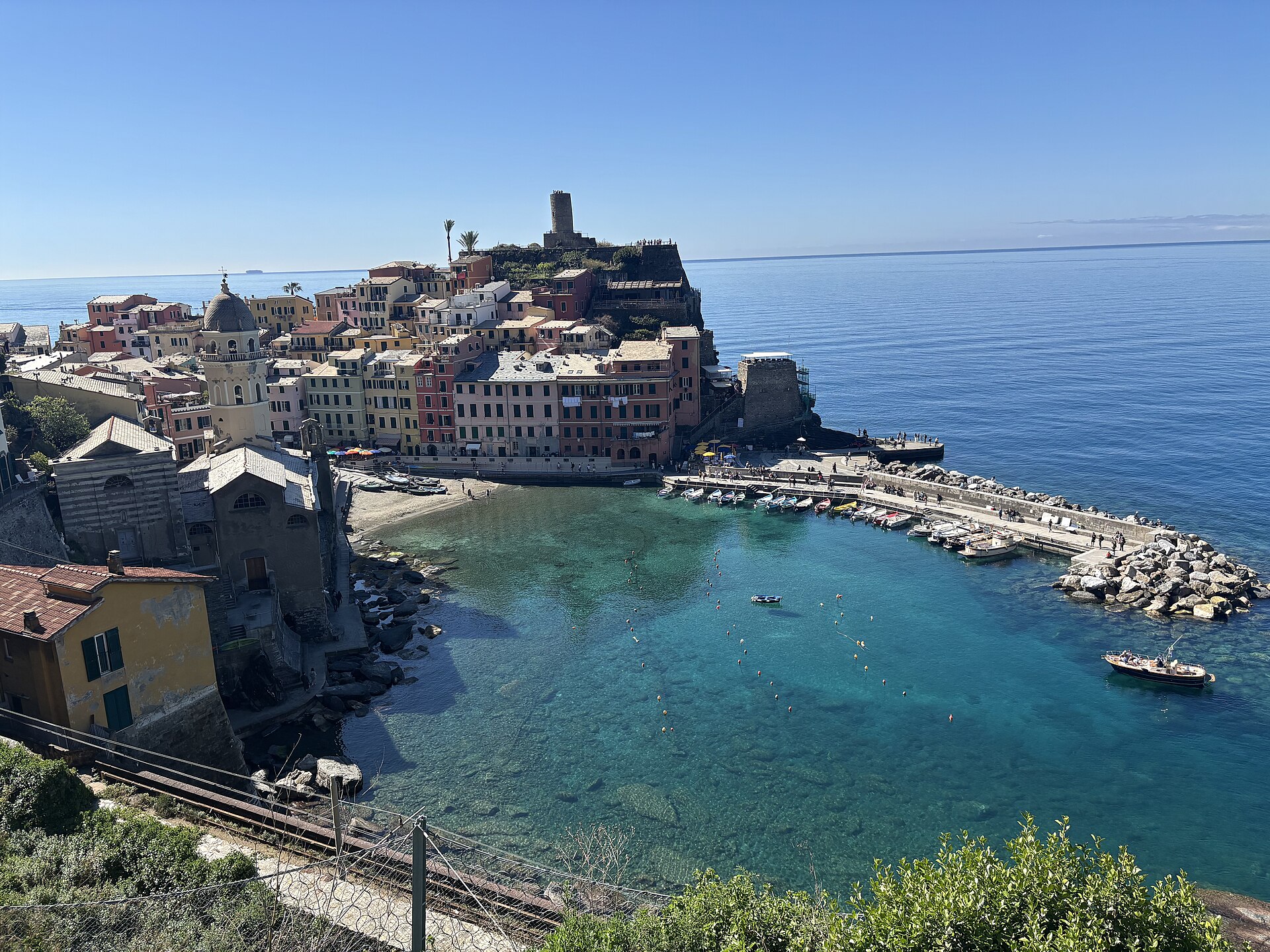 Vernazza harbour in the Cinque Terre, with the coastal railway line running below the village